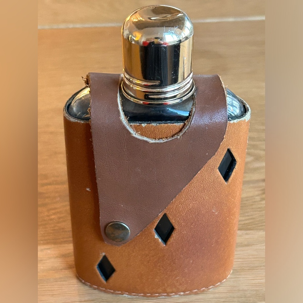 Vintage Flask , glass bottle with leather carrier Made in England .